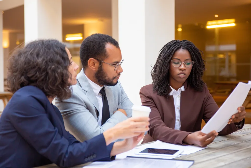 Divorce mortgage professional explaining home loan qualification and debt-to-income requirements to a client keeping the marital home